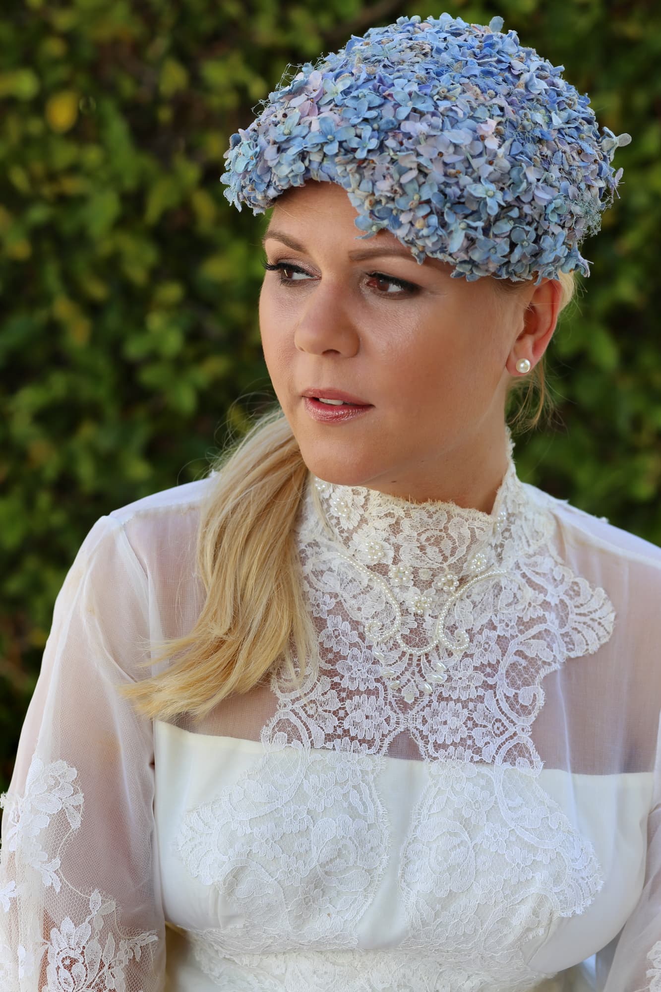 Bride with softly sculpted makeup and a floral headpiece